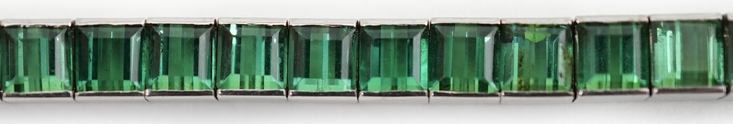 A white gold (tests as 18ct) and green tourmaline line bracelet